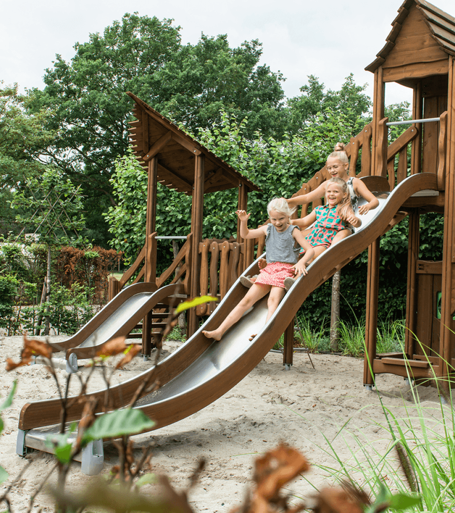 Three kids on a slide