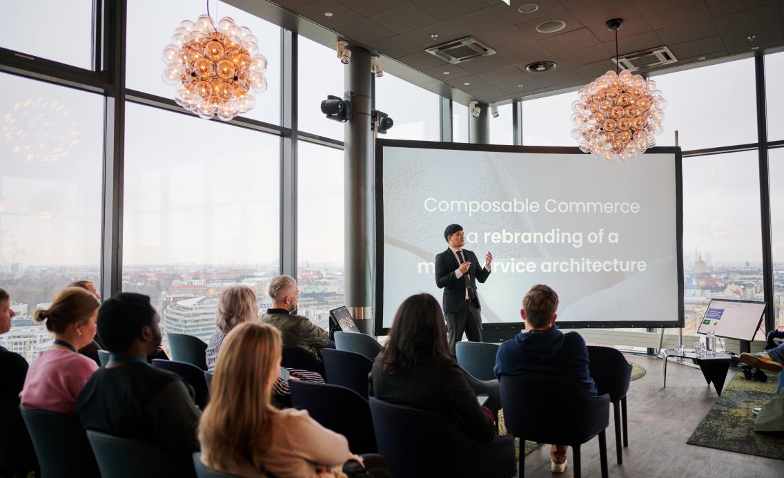 Man presenting to a crowd about composable commerce