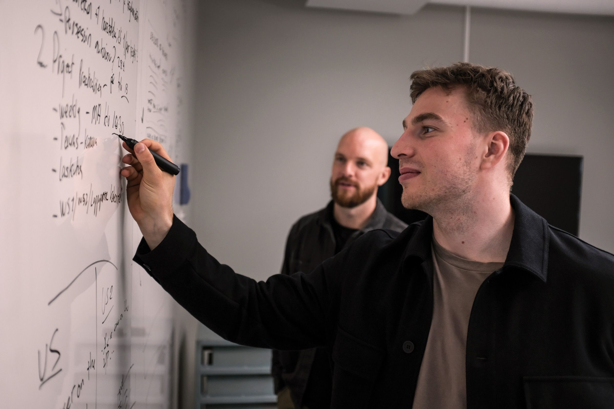 Sebastian working with a colleague