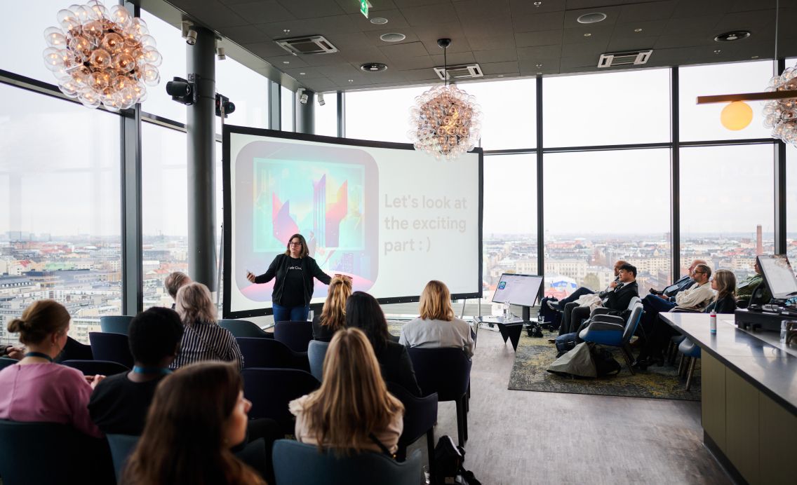Sandra Calvo presenting at a company event